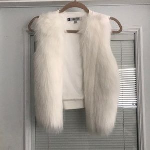 White fur vest
